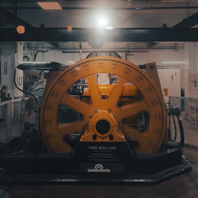 Safety-orange lift bullwheel in the machine room